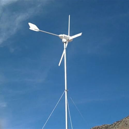 Wind turbine against a clear blue sky.